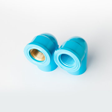 Blue PVC pipe fitting with screw connection on white background