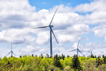 Fototapeta premium Closeup of large, huge wind turbines on Gaspesie coast in Quebec, Canada in Capucins