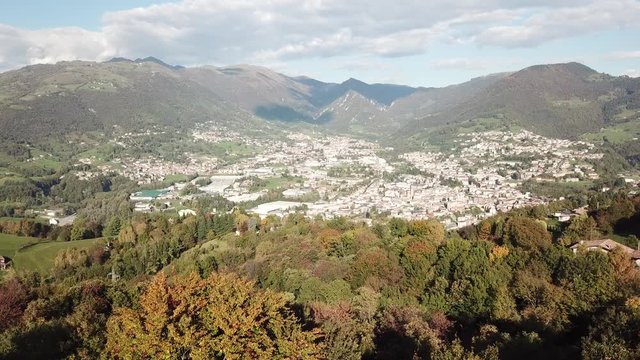 4K Drone aerial view to the villages of Leffe, Gandino, Peia and Cazzano Sant Andrea, located at Gandino Valley, Bergamo, Italy during autumn season
