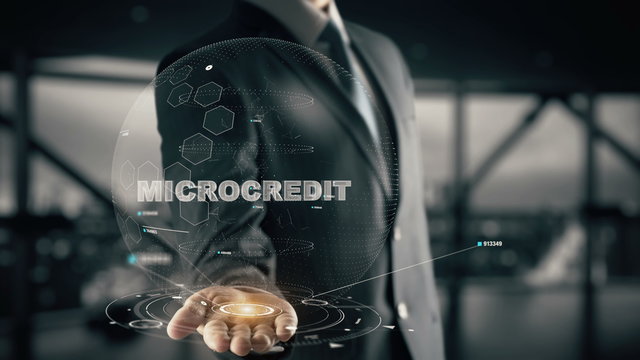 Microcredit with hologram businessman concept