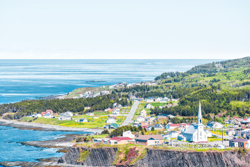 Aerial cityscape skyline view of Grande-Vallee village town and Saint Lawrence river gulf during day in Gaspe Peninsula, Quebec, Canada, Gaspesie region - Powered by Adobe