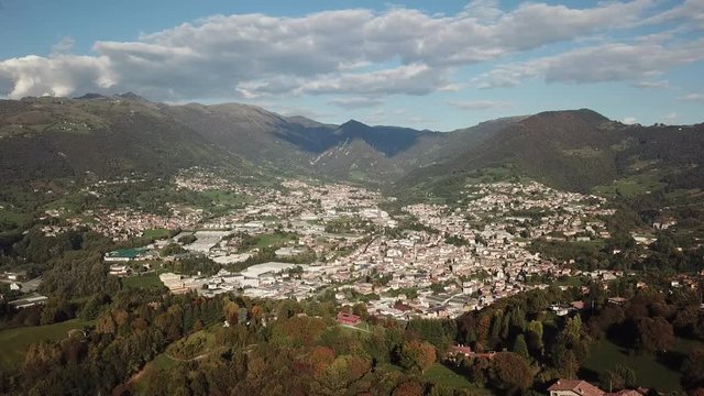 4K Drone aerial view to the villages of Leffe, Gandino, Peia and Cazzano Sant Andrea, located at Gandino Valley, Bergamo, Italy during autumn season