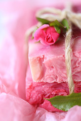 Rose handmade soap. handmade soap pink  close-up  with roses on pink crumpled paper. Organic Vegetable Cosmetics Concept