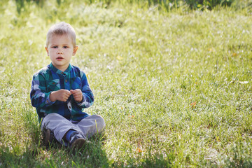 Little boy having fun playing in the Park on the grass