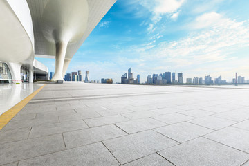 Empty square floor and modern city commercial building