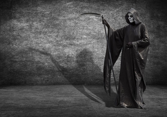 A man dressed as the grim Reaper. Poster for Halloween with space for your text.