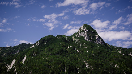 Landscape south side view of mountain peak Šija. Summer in Julian Alps, Bohinj, Slovenia, Europe.