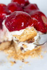 Strawberry on Fork with Pie Behind