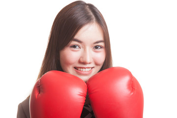 Young Asian business woman with red boxing gloves.