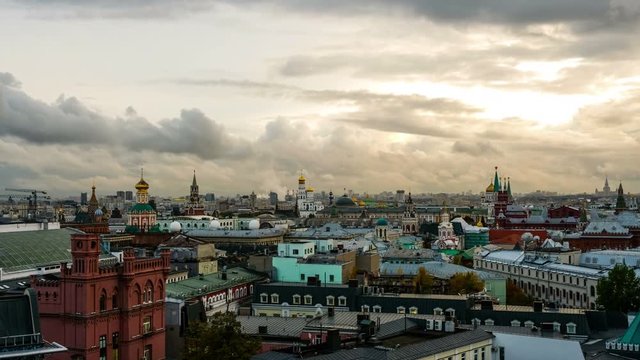 Moscow, Russia. Aerial view of popular landmarks - Kremlin walls, Saint Basil Cathedral and others - in Moscow, Russia. Time-lapse at sunset with cloudy sky. Evening to night in Moscow