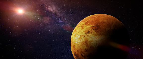 Naklejka premium planet Venus in front of a colourful star field 