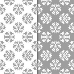Naklejka na ściany i meble White and gray floral backgrounds. Set of seamless patterns