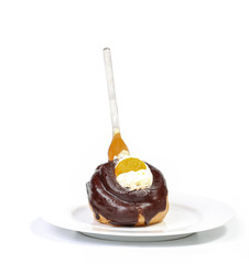 Chcolate profiterole with a fork
