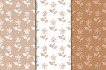 Brown floral backgrounds. Set of seamless patterns