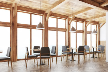 Wooden cafe interior, windows side