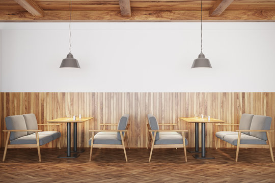 White and wooden cafe interior, sofas
