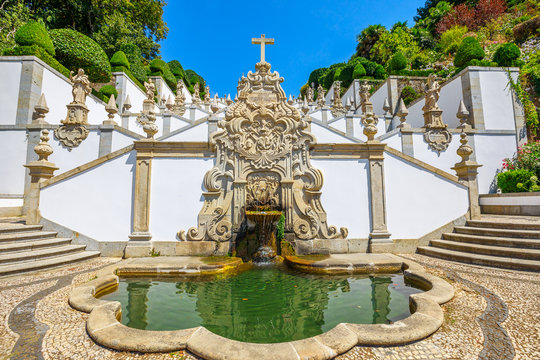 The first symbolic fountain at the beginning of ornamental stairway that zig zags up the hill towards the church of Bom Jesus do Monte, a popular pilgrimage site in northern Portugal, Tenoes in Braga.