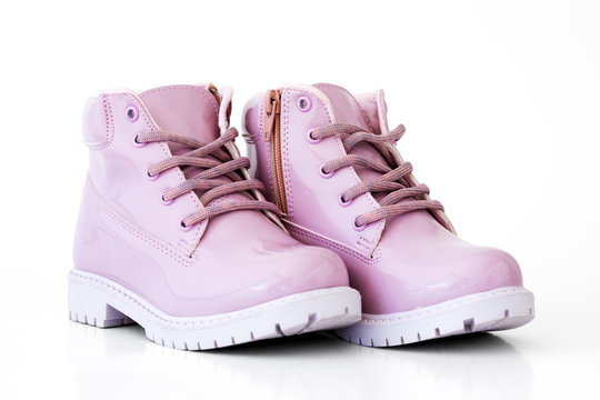 Pink boots isolated on a white background