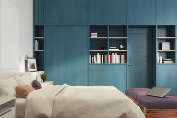 Fototapeta na wymiar White bedroom, blue bookcase, side