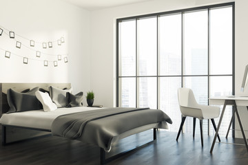 White bedroom with a photo gallery, gray corner