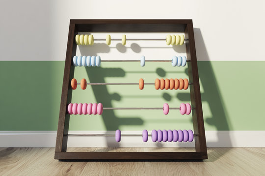 Children s colored abacus near wall