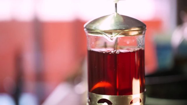 Brewing tea in a jug - Tea leaves floating in tea decoction
