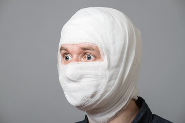 Man with bandage on his head