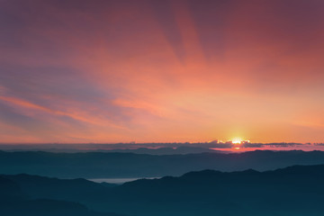 Landscape panorama dramatic sunset and sunrise sky on mountain layer.