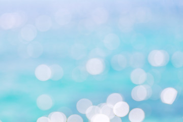 Defocused of blue water surface with waves glittering in the sun