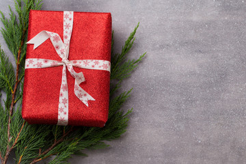 Christmas presents with ribbon on grey  background.