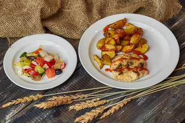 Fried potato with meat and salad