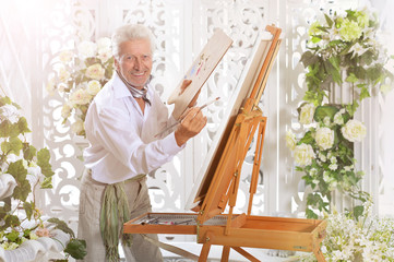Senior man drawing picture