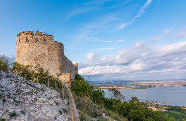 Fototapeta na wymiar Castle in Palava, Czech republic, ruins of wall, landscape panorama of near village