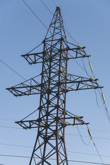 Vertical photo: Power Tower on blue sky background