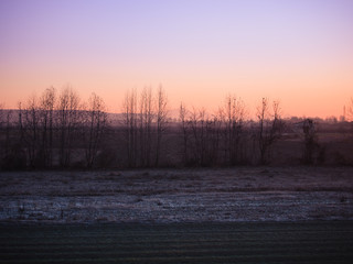 Winter sunrise over the ice-cold countryside.