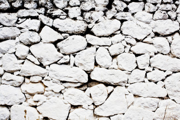 sfondo muro in pietre dipinte di bianco.isola greca.