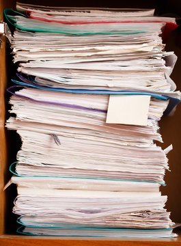 Archive of record. A stack of paper with a blank bookmark on. Keeping files, business documents, dossier