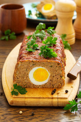 Baked meat loaf with eggs for Easter holiday.