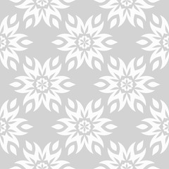 Floral ornaments. Gray and white seamless pattern