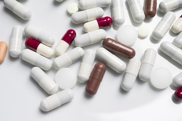 Close up, red, white, brown, medicine pills, isolate, white backgraund