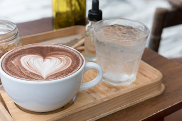 hot chocolate drink with heart latte art. delicious  cocoa beverage serve with flavor and brown sugar