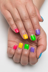 festive blue, purple, light green, green, yellow, pink manicure on short square nails
