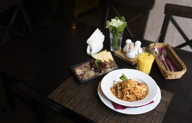 lunch Pasta Bolognese, Veal , glasses of juice