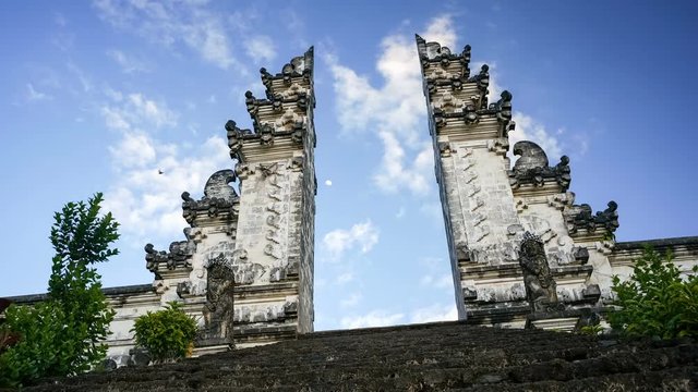 Steps leading to the split gateway of the temple PuraLuhur Lempuyang, Bali, Indonesia. The split gateway is the traditional balinese entrance to the temple which is named candi bentar. Timelapse.