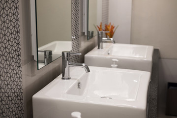 modern bathroom interior. white washbasin sink & chrome faucet