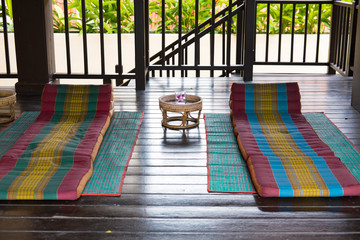 Thai triangular backrest pillow on mat. Thailand scatter cushion mattress for spa massage....