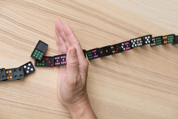 hand stop continuous toppled, prevent domino effect. risk, failure solution & strategy in business.