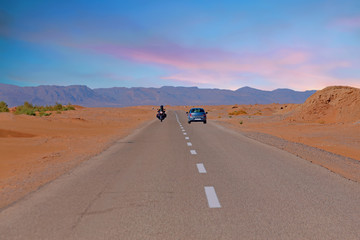 Driving through the Sahara Desert in Morocco Africa at sunset © Nataraj