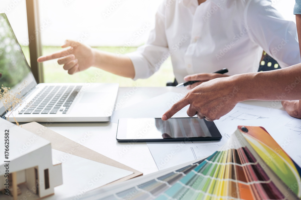 Leinwandbilder two interior design or graphic designer at work on project of architecture drawing with work tools a