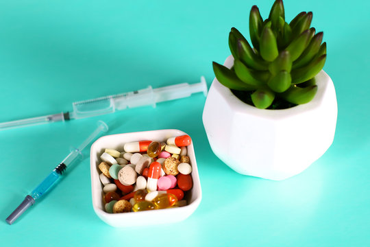 Medicine pills, tablets and capsules on table